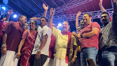 BBC News/Aakriti Thapar Mahinda Rajapaksa at a rally with his son Namal in the town of Minuwangoda