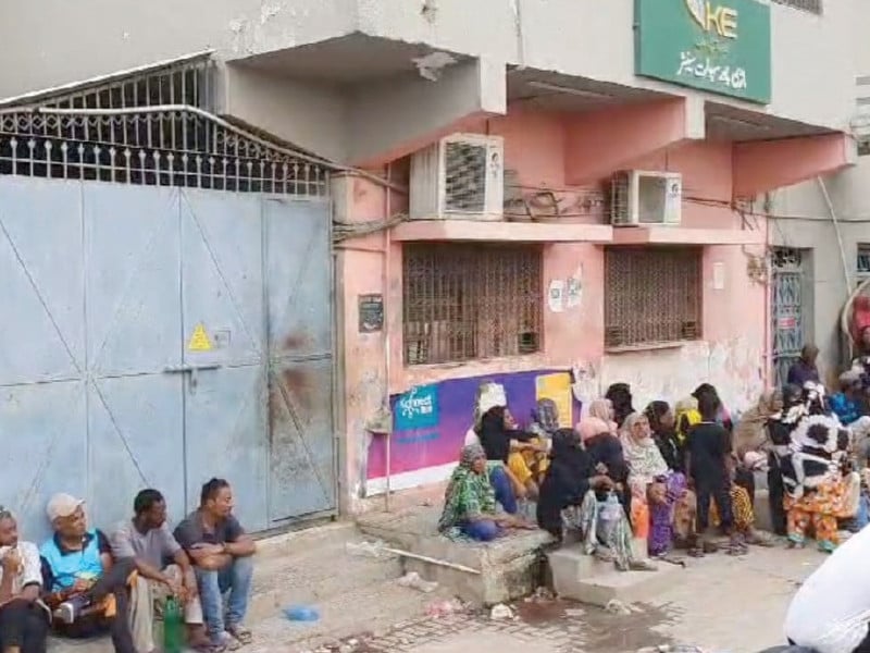 women sit outside the k electric office in mauripur in a protest against power disconnections photo express