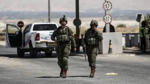 Getty Images Israeli forces investigate at the site after a truck driver opened fire at King Hussein (Allenby) Bridge crossing between Jordan and the West Bank on September 08, 2024, near Jerico