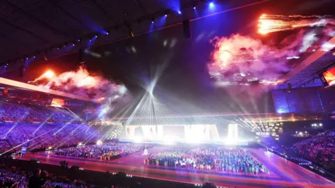 SNS Fireworks exploding above Celtic Park as the opening ceremony for the 2014 Commonwealth Games takes place