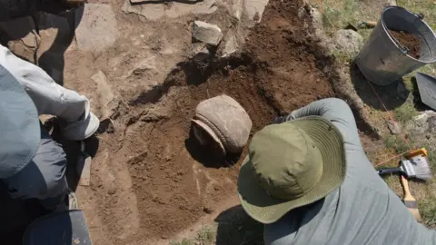 Michael Frachetti The research team excavating at the sites of Tashbulak and Tugunbulak