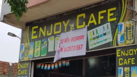 Amit Saini A shop in Muzaffarnagar in Uttar Pradesh state has added a poster with the name of shop's owner on it