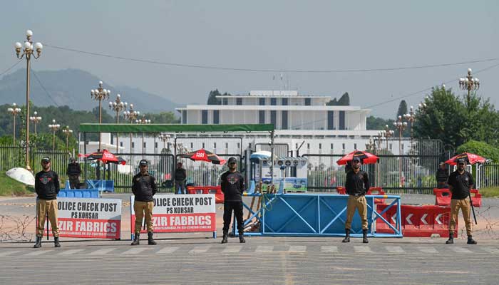 Security personnel stand guard in front of the Presidential Palace ahead of Shanghai Cooperation Organisation (SCO) summit in Islamabad on October 13, 2024. — AFP