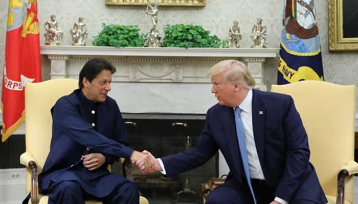 Former premier Imran Khan shakes hands with former US President Donald Trump at the start of their meeting in the Oval Office of the White House in Washington, July 22, 2019. —Reuters