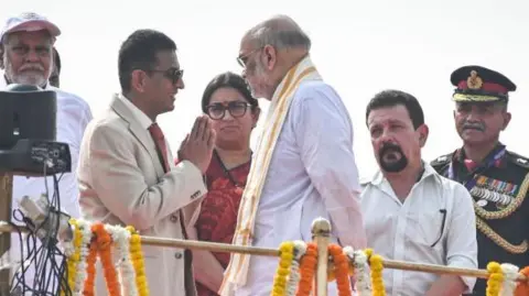 Getty Images NEW DELHI, INDIA AUGUST 15: Dhananjaya Yeshwant Chandrachud, Chief Justice of India greets Amit Shah, union Home Minister on the occasion of the 77th Independence Day at Red Fort on August 15, 2023 in New Delhi, India. (Photo by Raj K Raj/Hindustan Times via Getty Images)