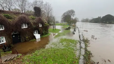 Edna Clouds | BBC Weather Watchers River appears close to bursting its bank near tea rooms at Llanrwst, Conwy