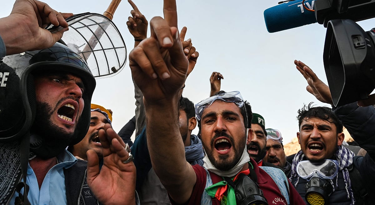 Supporters of jailed former prime minister Imran Khan´s PTI shout slogans as they march towards Islamabad after clearing containers in Hasan Abdal in Punjab province on November 25, 2024. — AFP