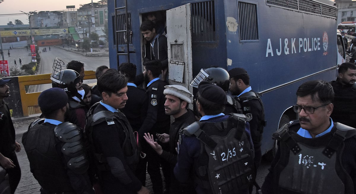 Policemen arresting PTI workers at Faizabad area during protest in the Federal Capital on November 25, 2024. — Online