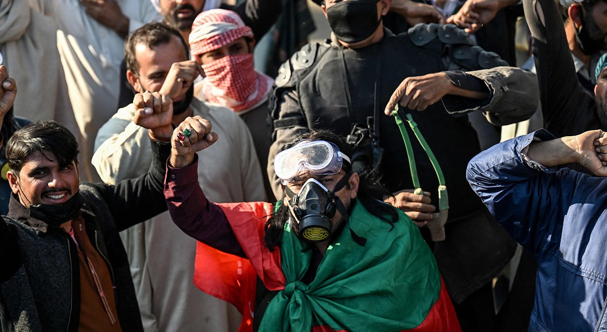 Supporters of jailed former prime minister Imran Khan´s PTI shout slogans as they march towards Islamabad after clearing containers in Hasan Abdal in Punjab province on November 25, 2024. — AFP