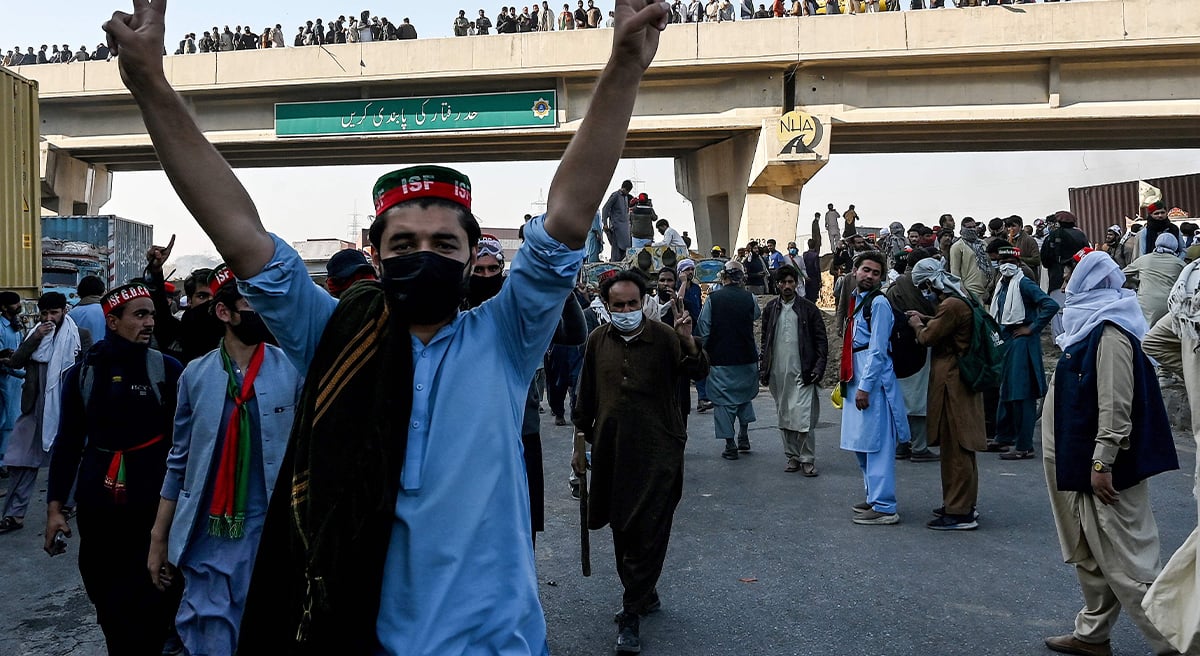 Supporters of jailed former prime minister Imran Khan´s PTI march towards Islamabad after clearing shipping containers placed by authorities during a demonstration in Hasan Abdal in Punjab province on November 25, 2024. — AFP