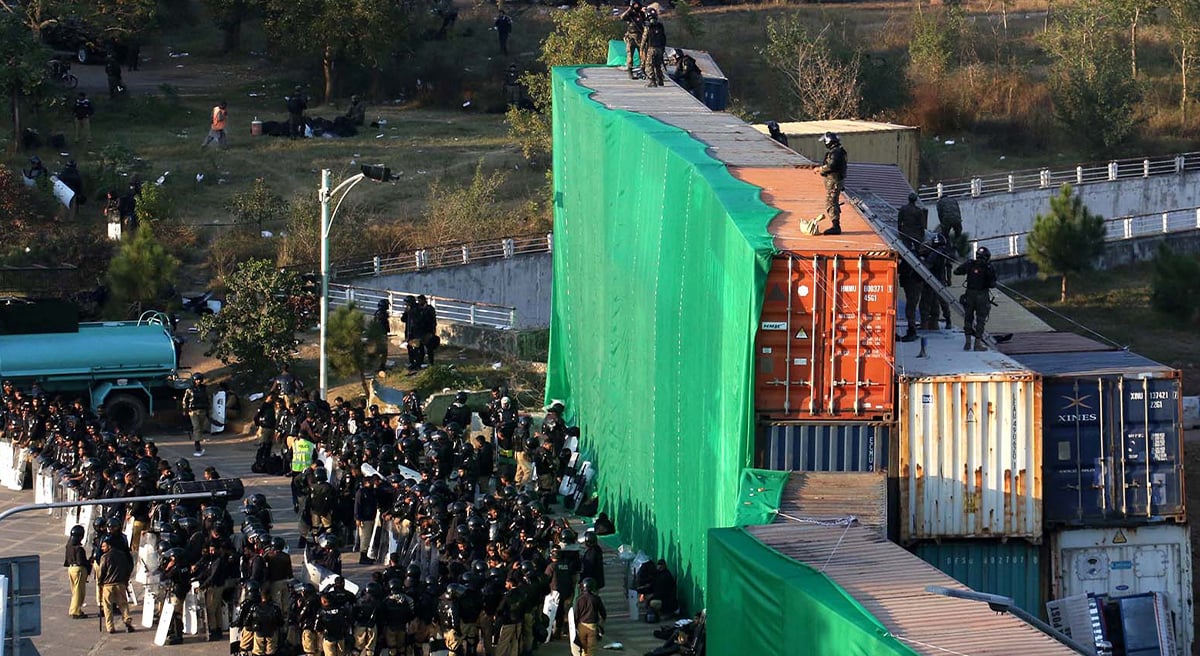 A view of large number of police personal stand near container at D chowk due to PTI protest in twin cites on November 25, 2024. —  INP