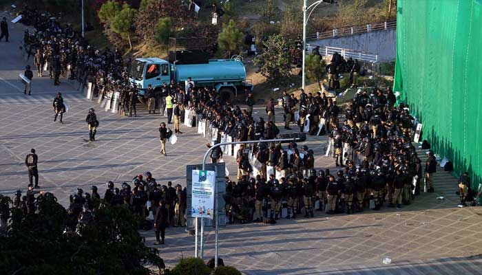 A view of large number of police personal stand near container at D chowk due to PTI protest in twin cites on November 25, 2024. — INP