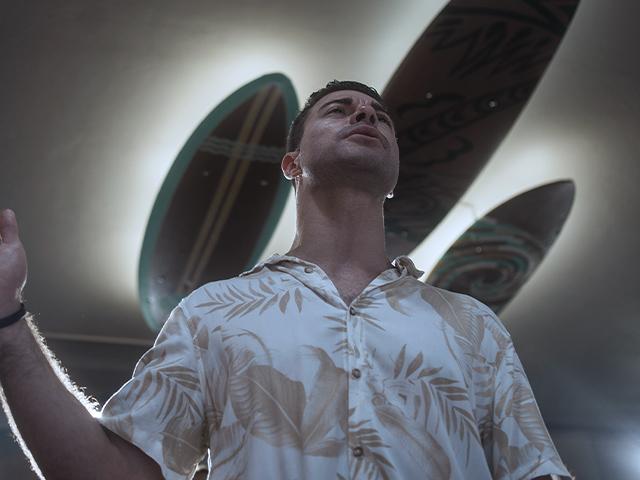 Surf Church pastor, the Rev. Samuel Cianelli, preaches to his congregation at the church in Porto, Portugal on Sunday, Aug. 18, 2024. (AP Photo/Luis Andres Henao)