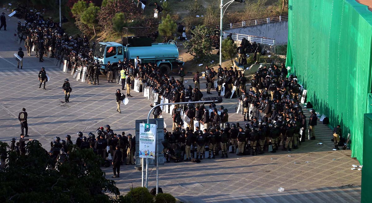 A view of large number of police personal stand near container at D chowk due to PTI protest in twin cites on November 25, 2024. — INP