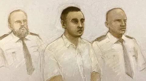 PA Media Court artist's sketch of Nasen Saadi, showing his short, dark hair and a thin moustache. Security guards sit either side of him.