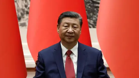 Reuters Chinese President Xi Jinping in a navy blue suit at the Great Hall of the People on May 31, 2024 in Beijing, China.