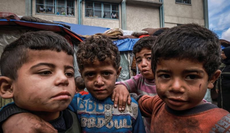 displaced children in front of makeshift tents in rafah on march 14 2024 photo afp