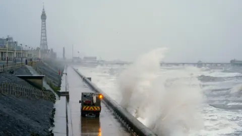 PA Media Waves break on the sea front in Blackpool