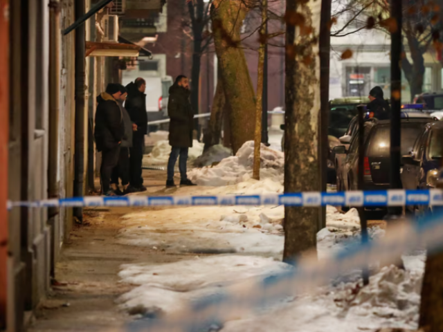 police and security personnel stand on a street in front of a firetruck near the scene where a gunman opened fire at a restaurant and killed several people in cetinje montenegro january 1 2025 reuters stevo vasiljevic