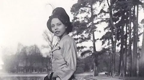 Eve Blouin A black and white picture of Andrée Blouin wearing a hat