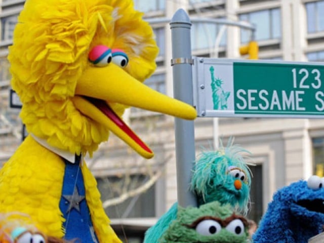 Big Bird (L) and other Sesame Street pup