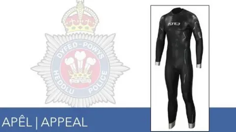 Dyfed-Powys Police Police appeal for information for a man found dead in Claerwen Reservoir with a picture of the full-length black wetsuit he was wearing when he was recovered