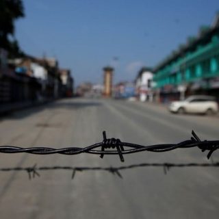 barbed wire is seen laid on a deserted road in srinagar photo reuters file