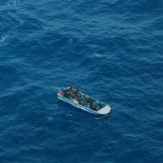 Aerial view shows a packed migrant boat en route from Libya in the central Mediterranean Sea. — Reuters/File