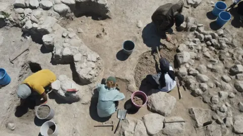 Getty Images  An aerial view of archeologists working on the excavation operation area, aiming to find remains from the Iron Age, conducted by Turkish Ministry of Culture and Tourism and Usak University in the Hittite city of Nerik in Vezirkopru district of Samsun, Turkiye on August 27, 2023.