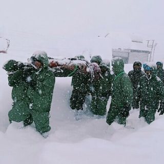 in this handout photo taken and released by the state disaster response force on february 28 rescuers carry border roads organisation workers after an avalanche near mana village in uttarakhand s chamoli district photo afp