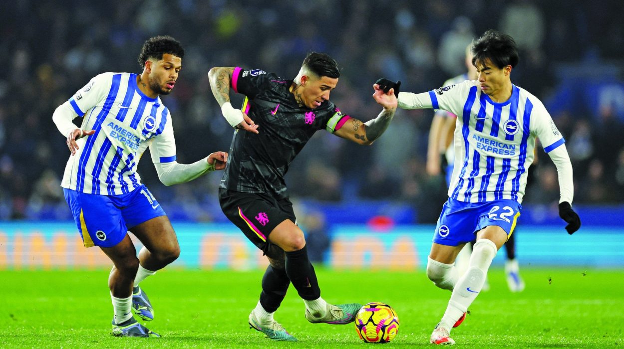 chelsea s enzo fernandez in action with brighton hove albion s kaoru mitoma and georginio rutter at english premier league at the american express community stadium photo afp