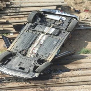 Car falls off bridge after being hit by trailer in Karachi