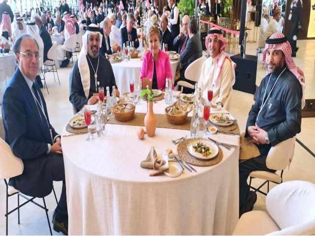 finance minister muhammad aurangzeb attends a luncheon alongside other dignitaries at the head table photo app