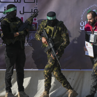 israeli yarden bibas 34 who has been held hostage by hamas in gaza since october 7 2023 is escorted by hamas fighters before being handed over to the red cross in khan younis southern gaza strip saturday feb 1 2025 photo abdel kareem