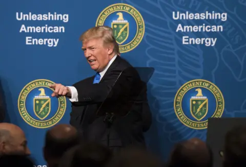 Getty Images U.S. President Donald Trump points while leaving the stage after speaking during the Unleashing American Energy event at the Department of Energy in Washington, D.C., U.S.