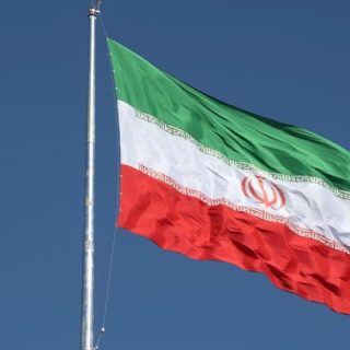 the iranian flag is seen flying over a street in tehran iran february 3 2023 photo reuters