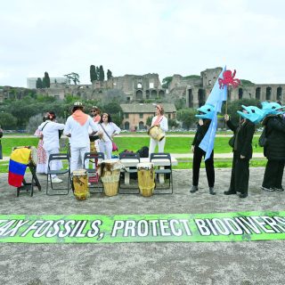 environmental activists take part in a flasmob at circo massimo at the un s food and agriculture organization headquarters in rome photo afp