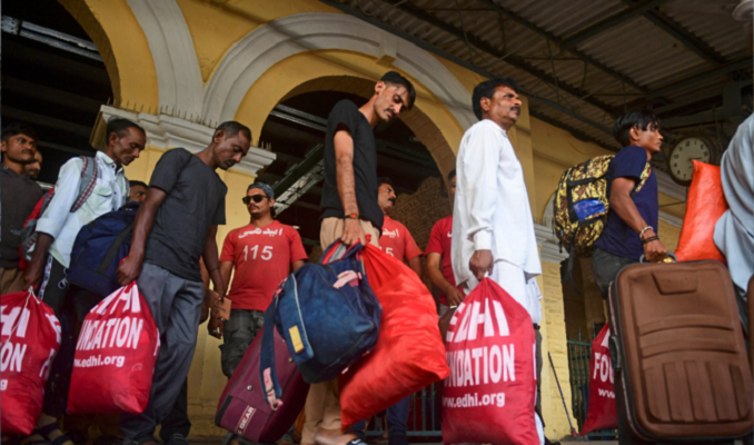 indian fishermen queue to depart a railway station in karachi on november 9 2023 after their release by pakistani authorities photo afp