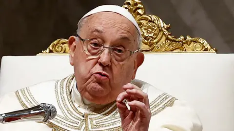 Reuters Pope Francis in white and gold vestments and glasses leading prayers at Saint Peter's Basilica at the Vatican at the beginning of February