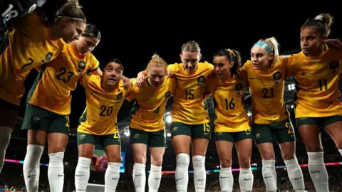 Getty Images Sam Kerr speaks to her team in a huddle before a World Cup match in Sydney in 2023