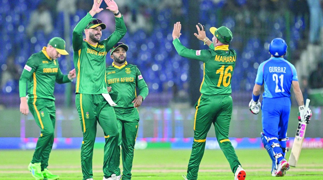 south africa s players celebrate the dismissal of afghanistan s rahmanullah gurbaz r during the icc champions trophy match at the national stadium in karachi on friday photo afp