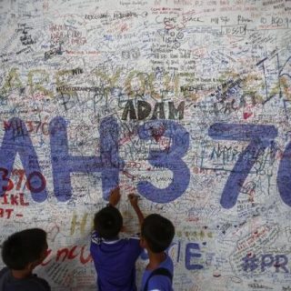 children write messages of hope for passengers of missing malaysia airlines flight mh370 at kuala lumpur international airport photo reuters