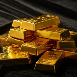 Trump tariffs push safe-haven gold to record peak