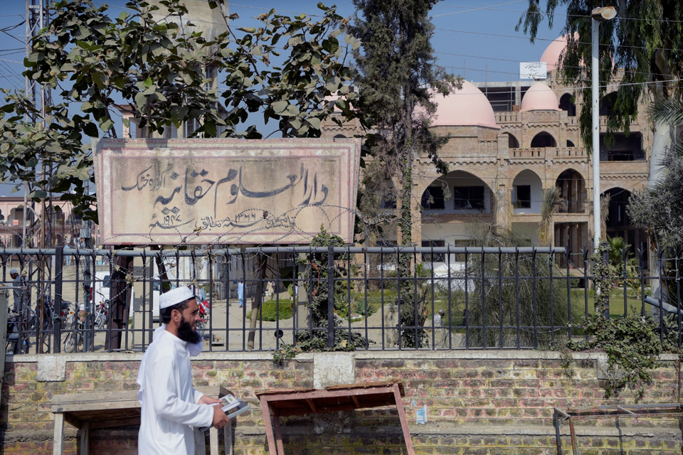 A Student from Darul Elom Haqqania Seminary in Akora Khattak is Seen Leaving the Institution on October 19, 2020. Photo: AFP