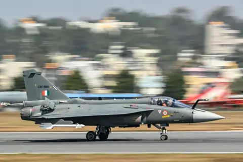 AFP The Indian Air Force (IAF) HAL Tejas fighter jet prepares to take off during Aero India 2025, a military aviation exhibition at the Yelahanka Air Force Station in Bengaluru on February 13, 2025.