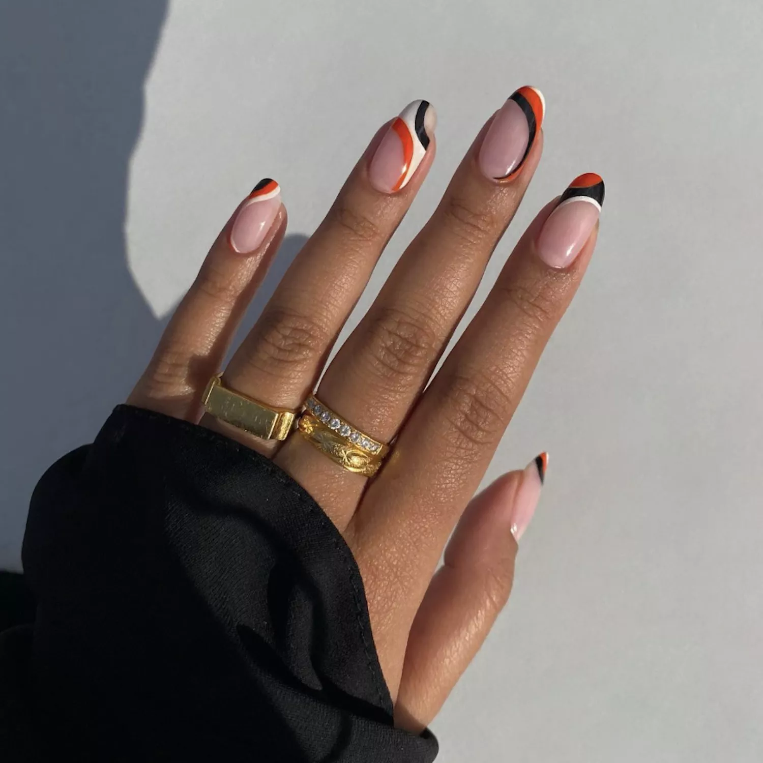 black and white and red swirly nails