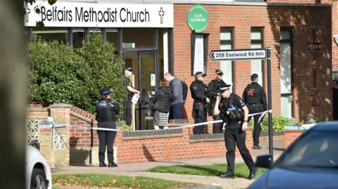 PA Media Armed police officers outside the Belfairs Methodist Church in Eastwood Road North, Leigh-on-Sea, Essex.