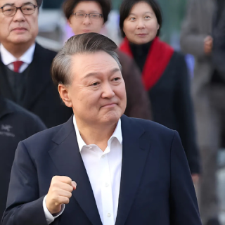 photo south korean impeached president yoon suk yeol gestures outside the seoul detention center after his release reuters