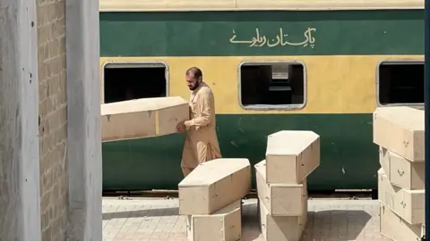 BBC Urdu Wooden coffins were seen being loaded at the Quetta railway station