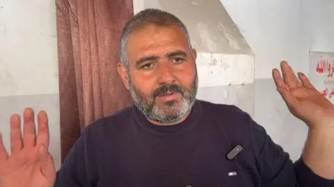 Arafat Hana, father of a Palestinian man who was killed by Israeli forces, speaking at the Al-Ahli Baptist Hospital in Gaza City